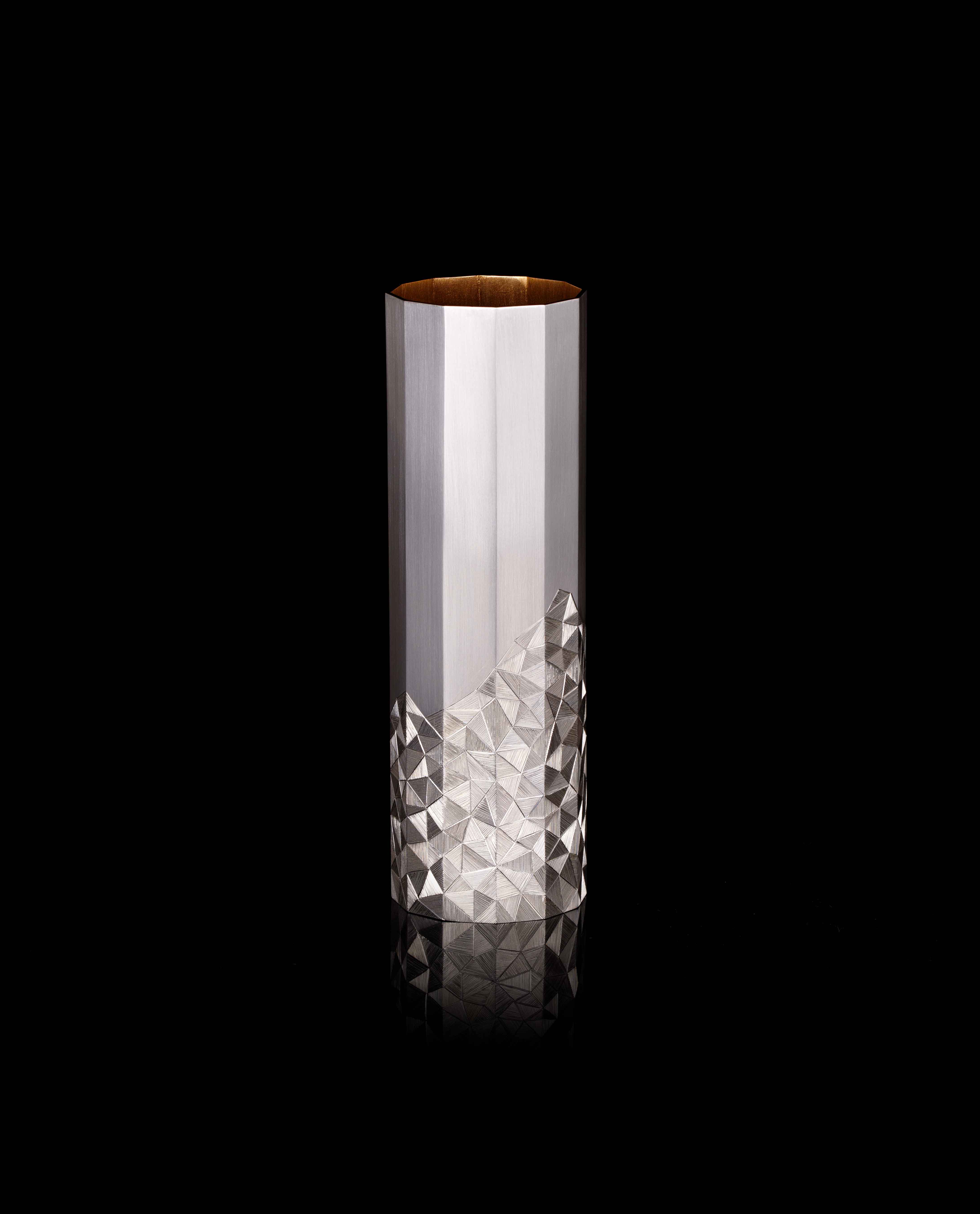 small vase with geometric engraved detail