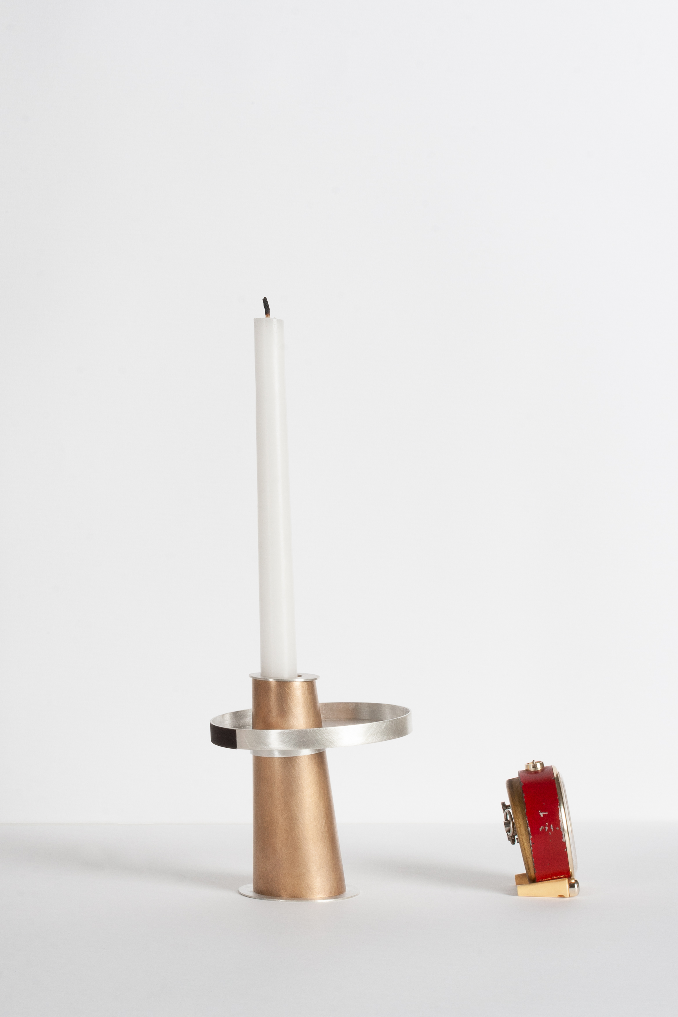 Candleholder for a clock