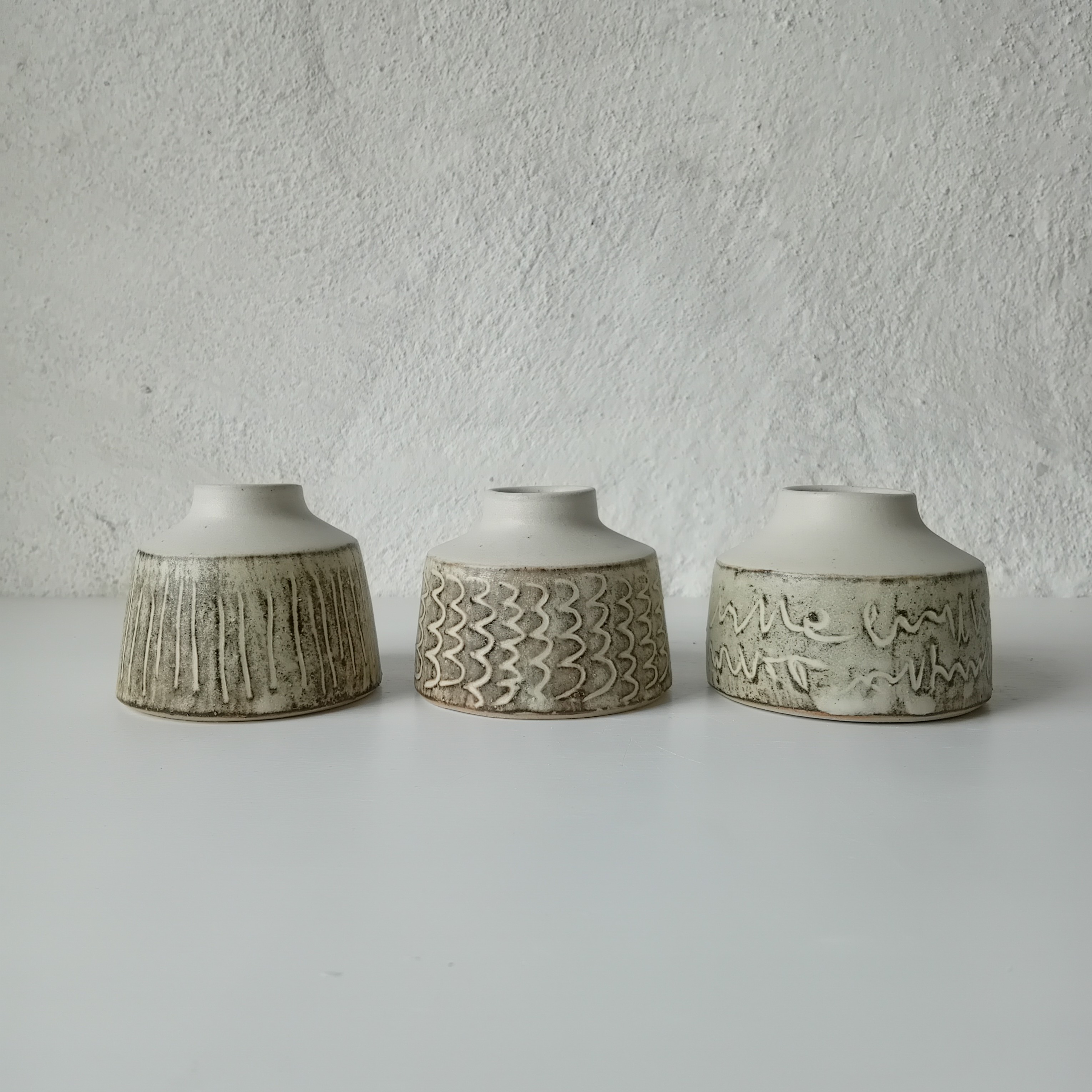 Tiny vases with wild clay